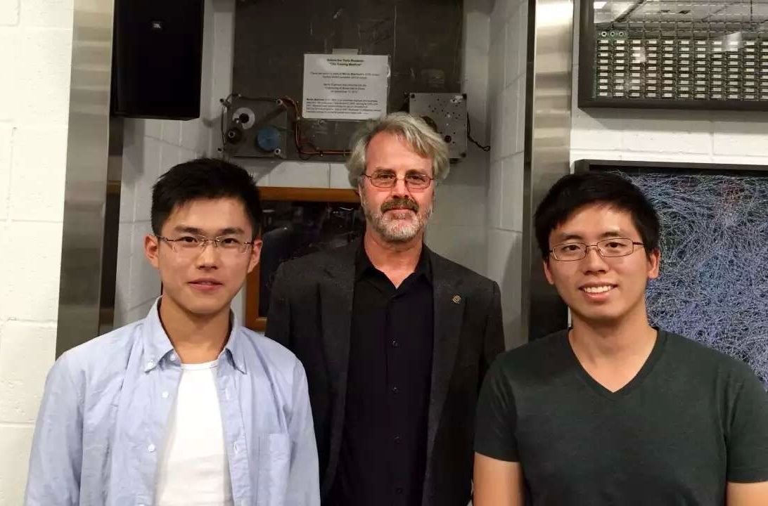 Yummy Future co-founders Jack Cui (far left) and Garrett Yan (far right) take a picture with Martin Eberhard (middle), co-founder of Tesla.